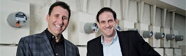Isaias Sudit (left), CEO of GridGlo, and CFO Richard Viens, stand outside a row of smart meters, in Boca Raton, Florida. Isaias Sudit (left), CEO of GridGlo, and CFO Richard Viens, stand outside a row of smart meters, in Boca Raton, Florida.