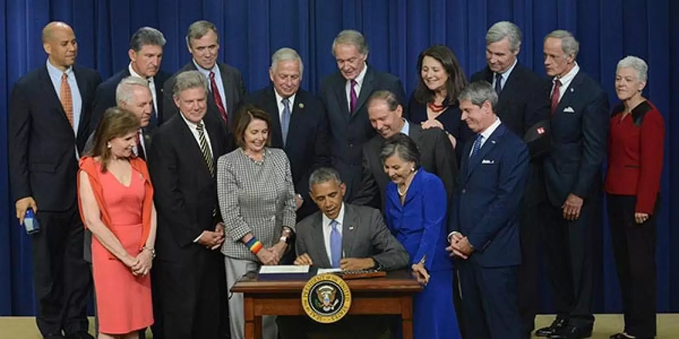 President Obama signing the Lautenberg Act