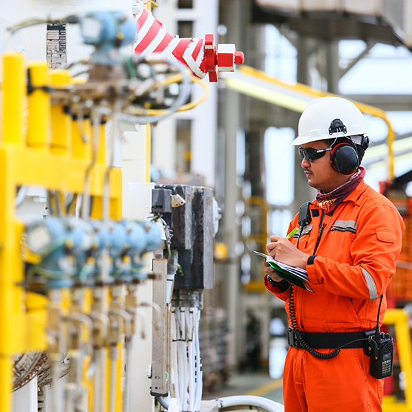 Inspector working on an oil and gas facility