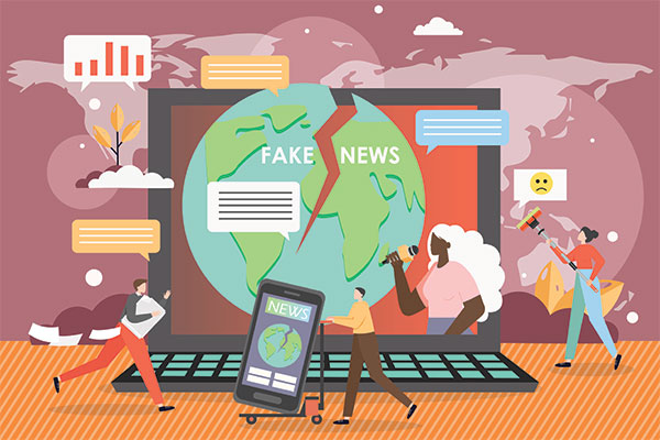 Fake news Image of characters hanging around a laptop with the words fake news on top of it