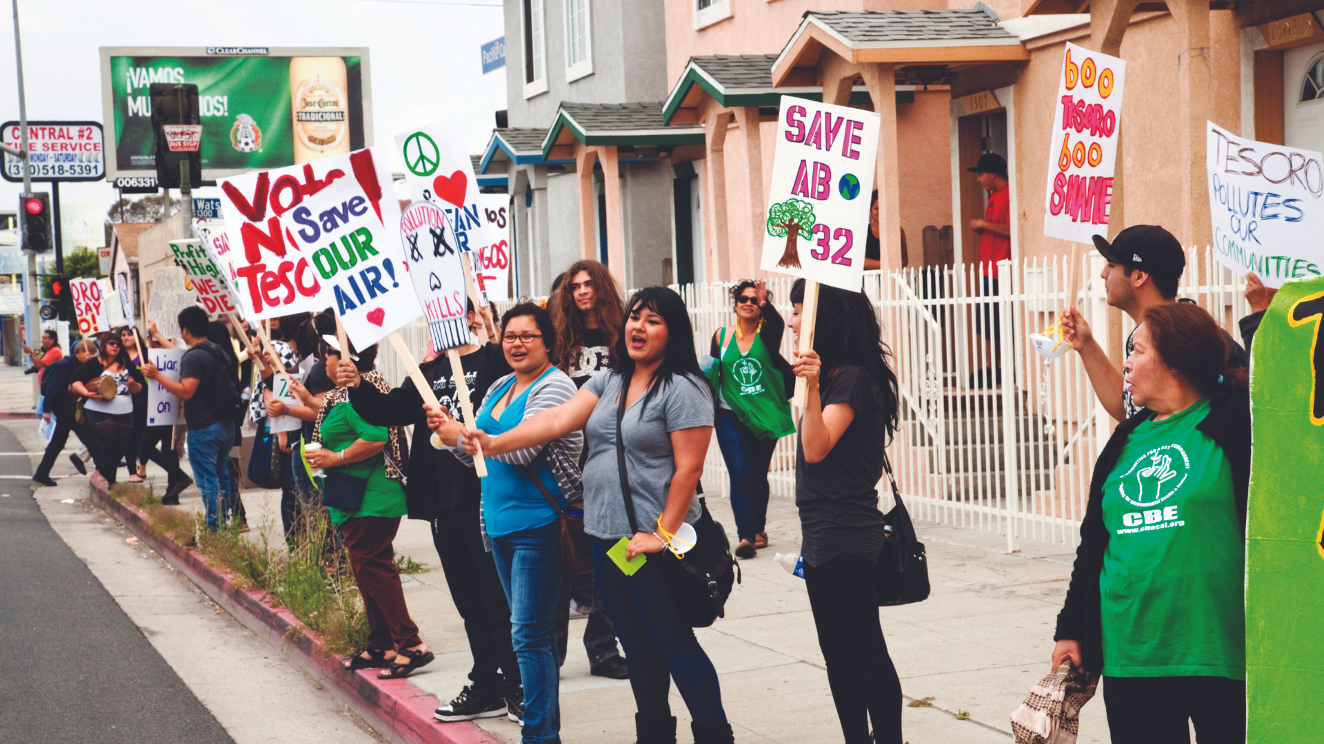 A group of protestors holding picket signs