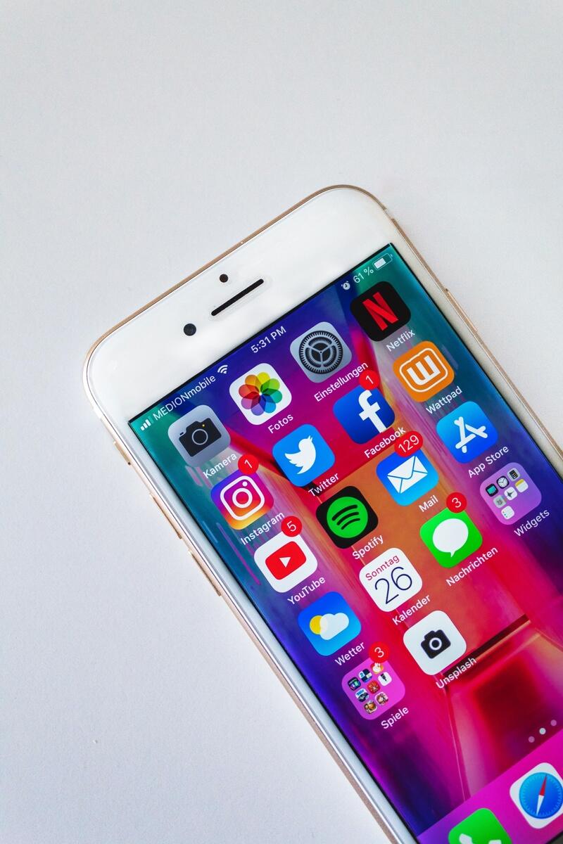 An iPhone showing social media icons on the home screen
