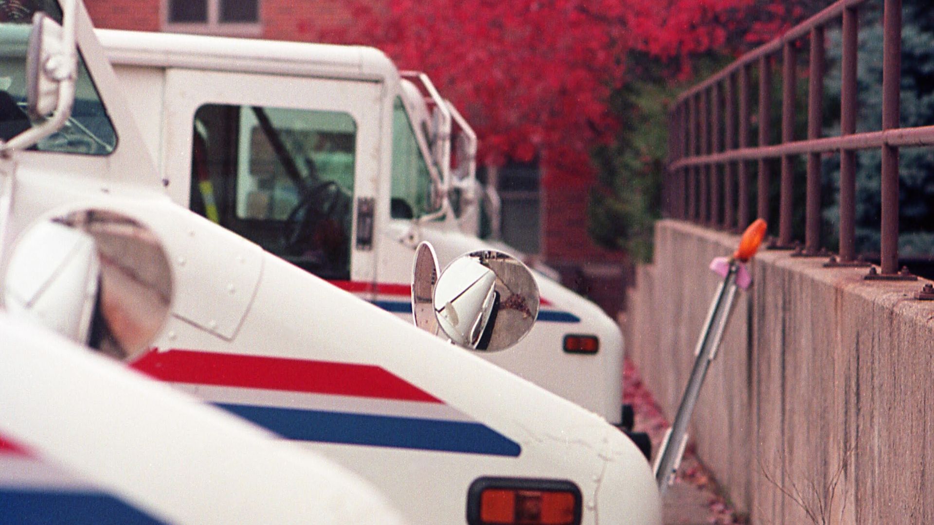 A row of USPS vehicles