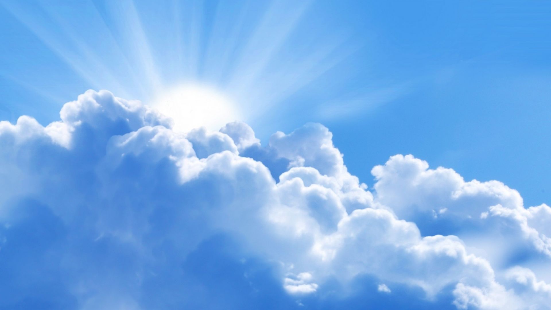 A blue sky with some puffy clouds