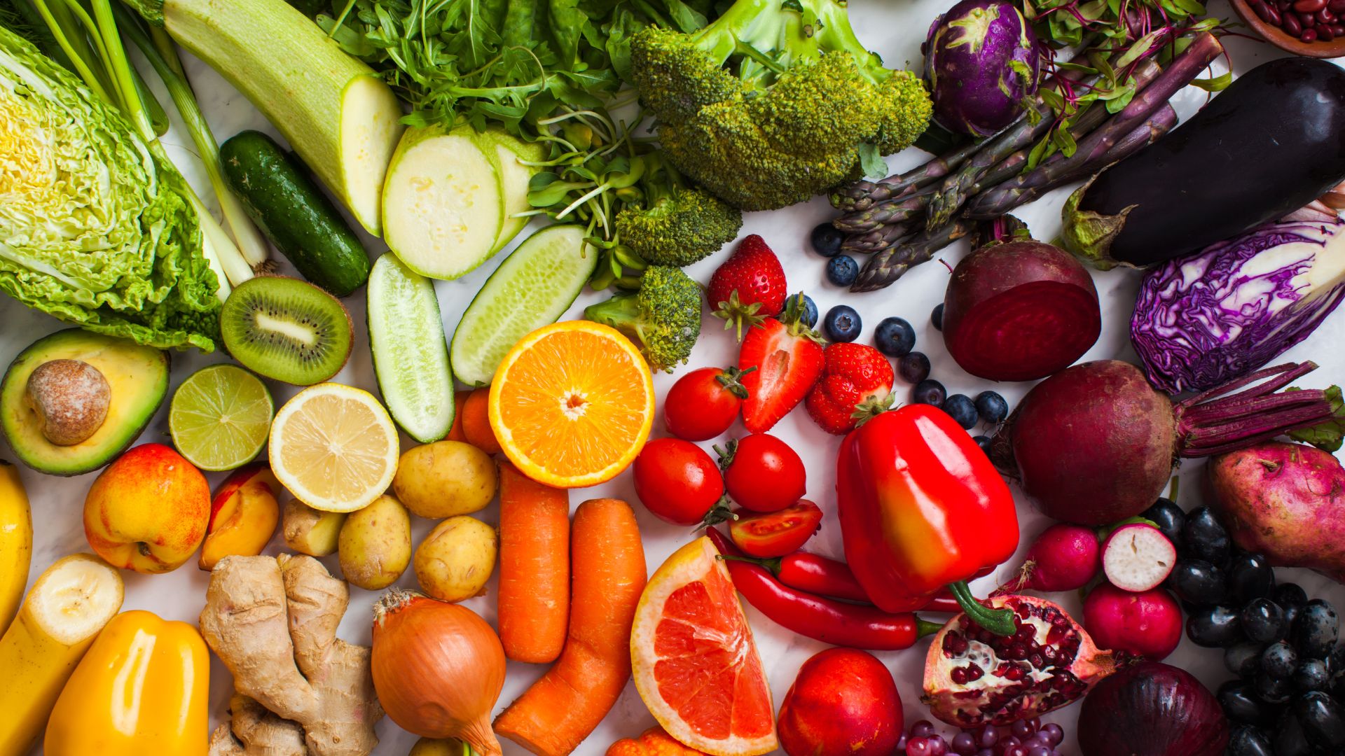 Colorful fruits and veggies are displayed