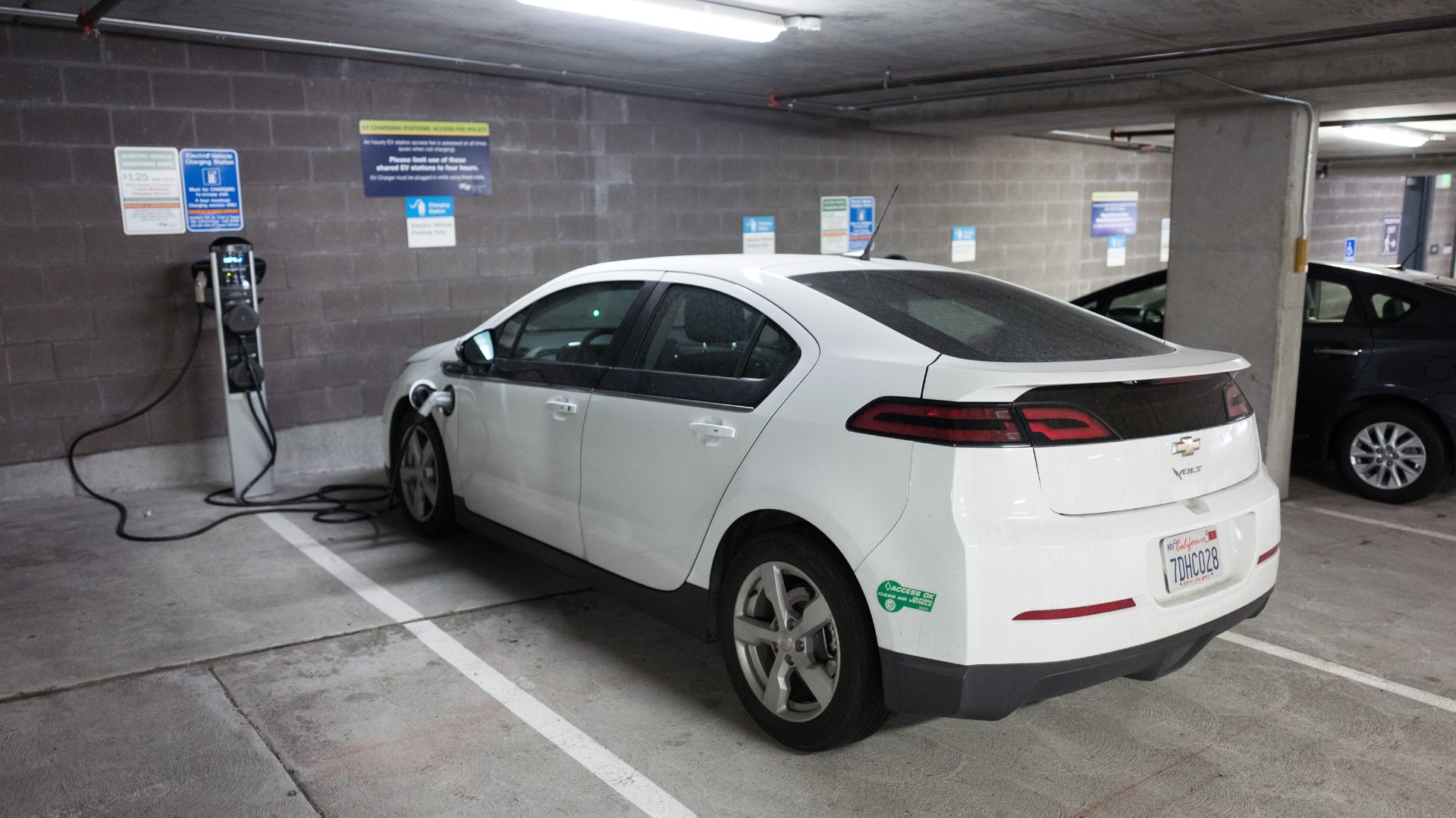An electric car parked at a charging station