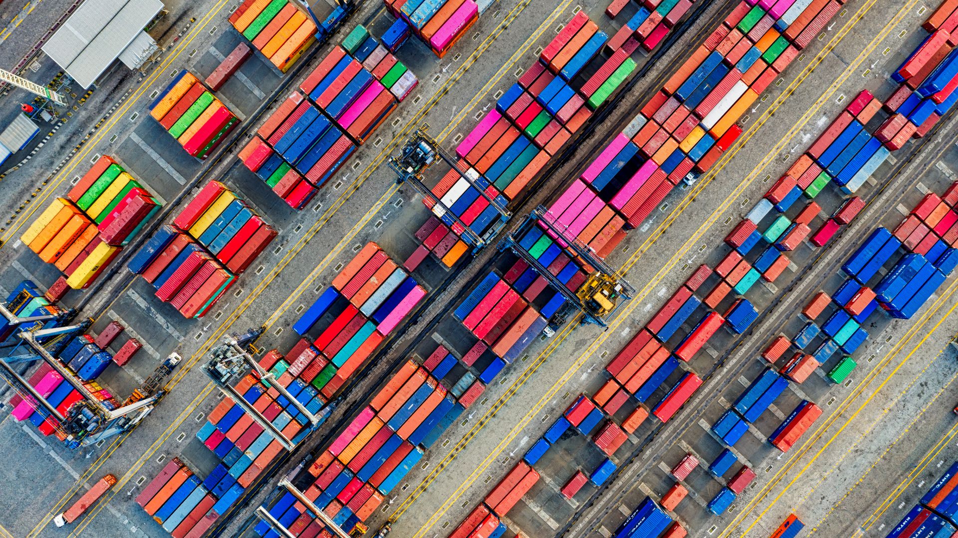 Overhead shot of a large row of shipping containers