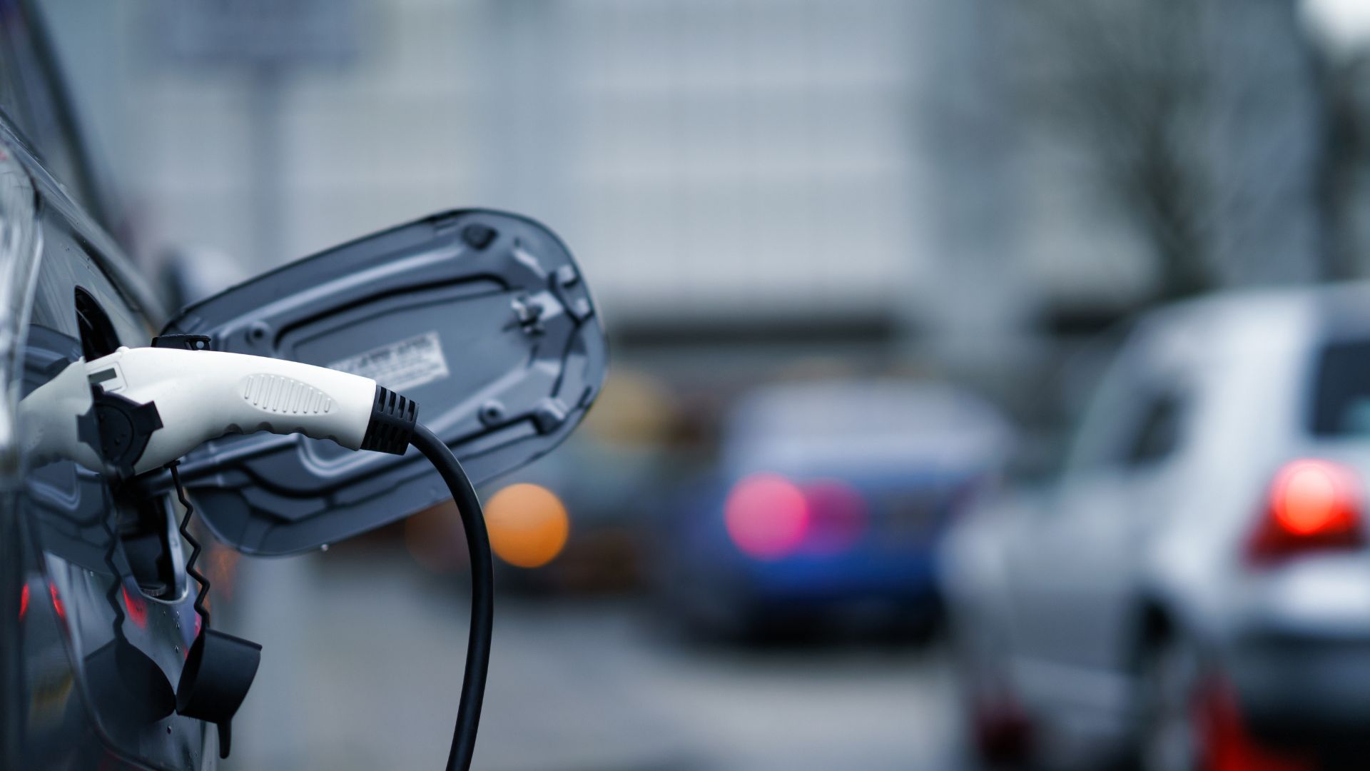 An electric vehicle plugged in and charging