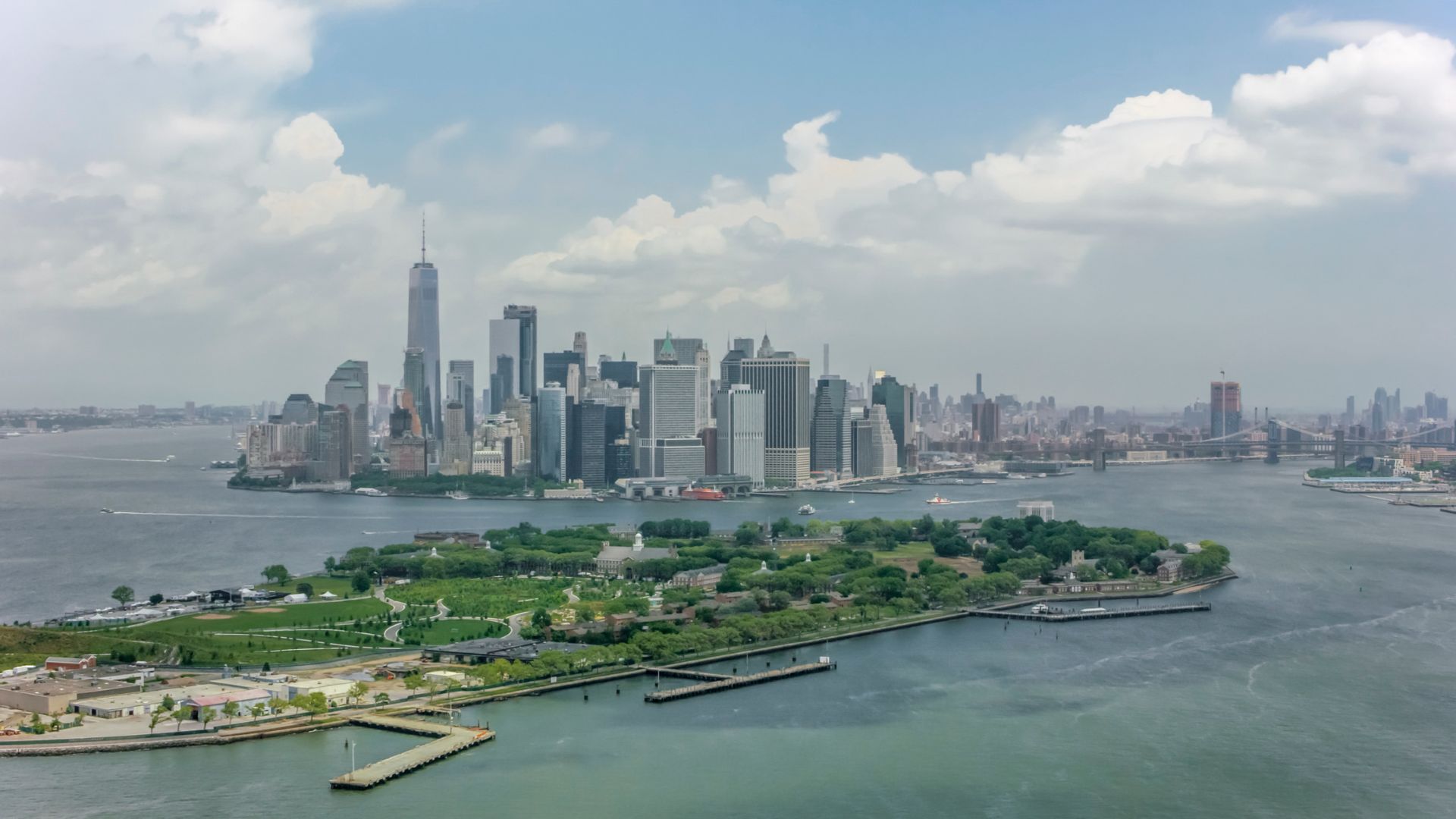 The New York City skyline in the distance with Governor's Island in the foreground