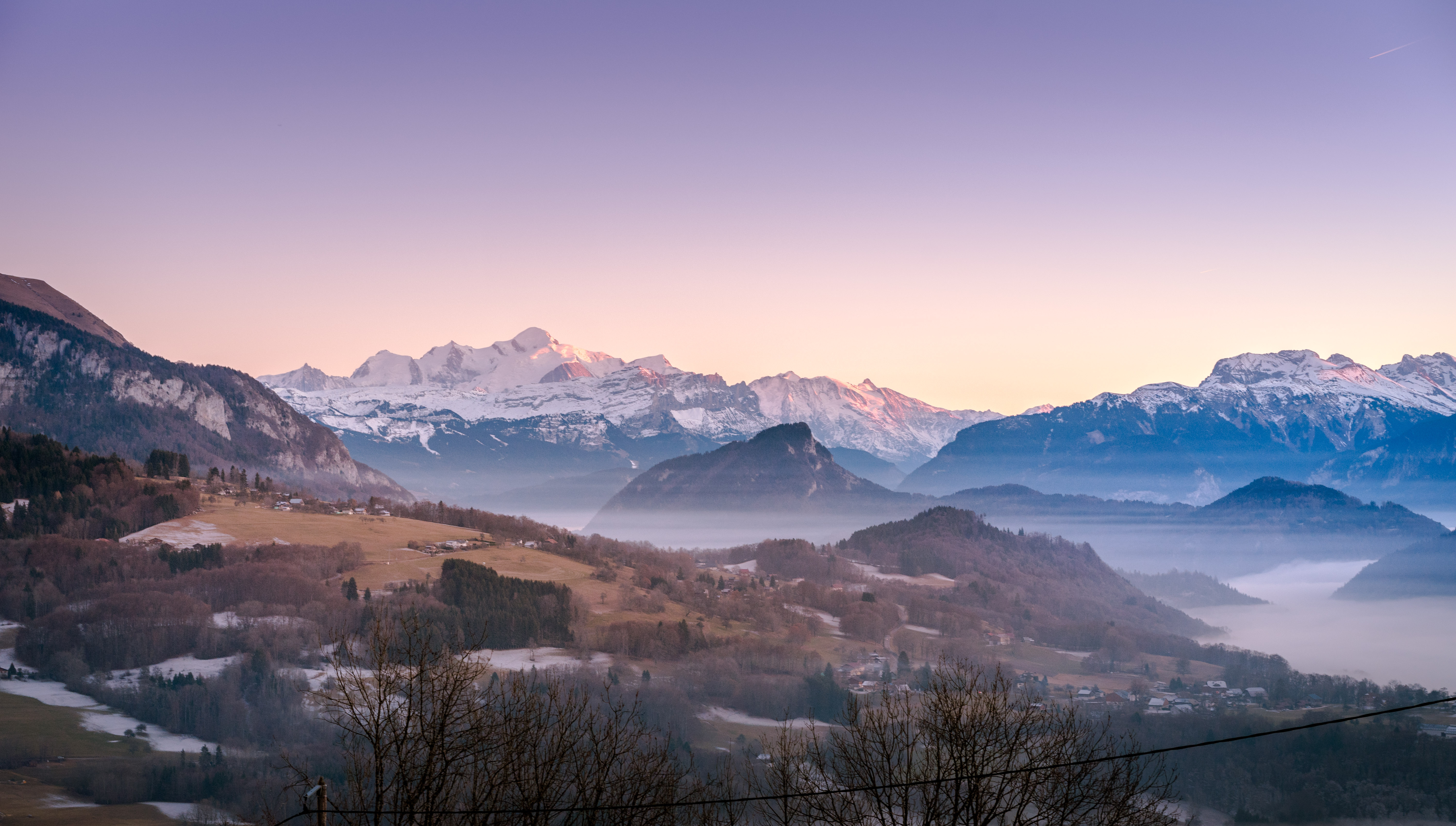 Sweeping, scenic view of a snow-capped mountain landscape <a href=