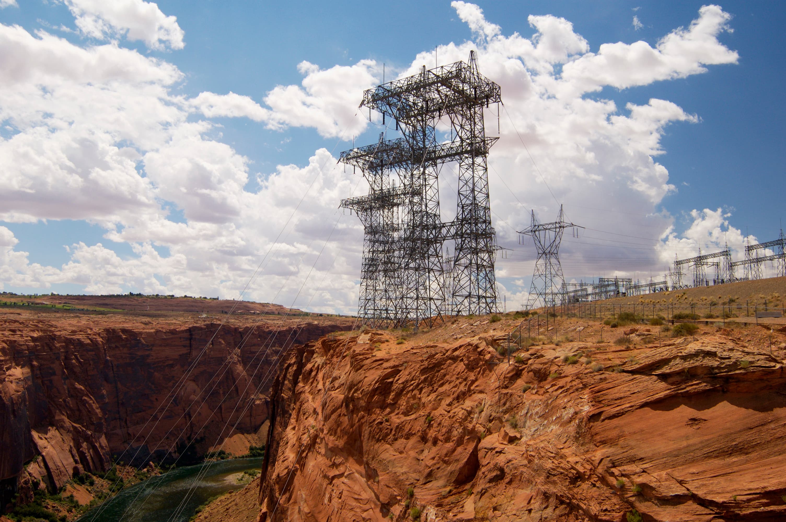 Electrical towers on rocky outcroppings.