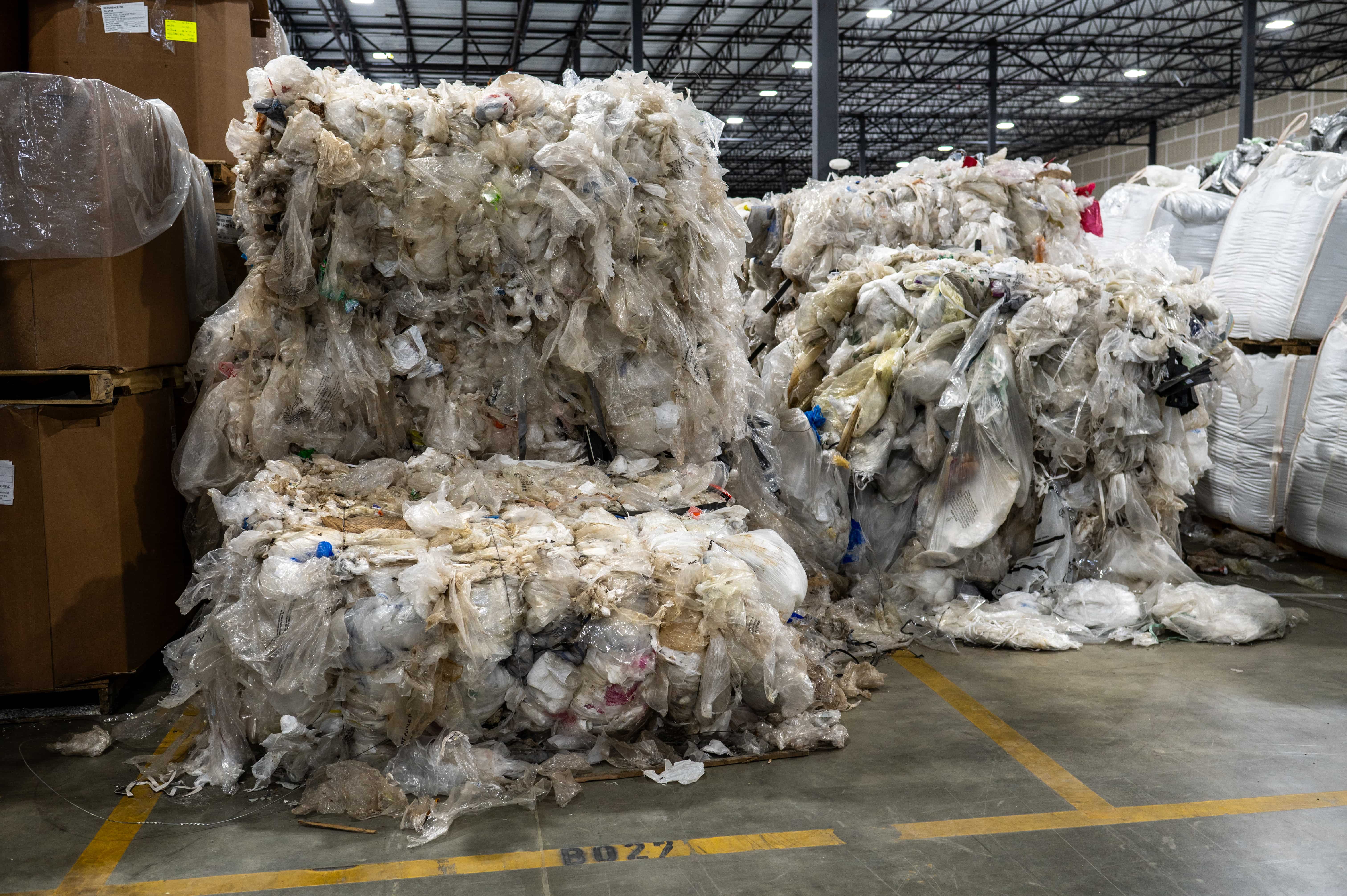 Overflowing pallets of plastic waste.