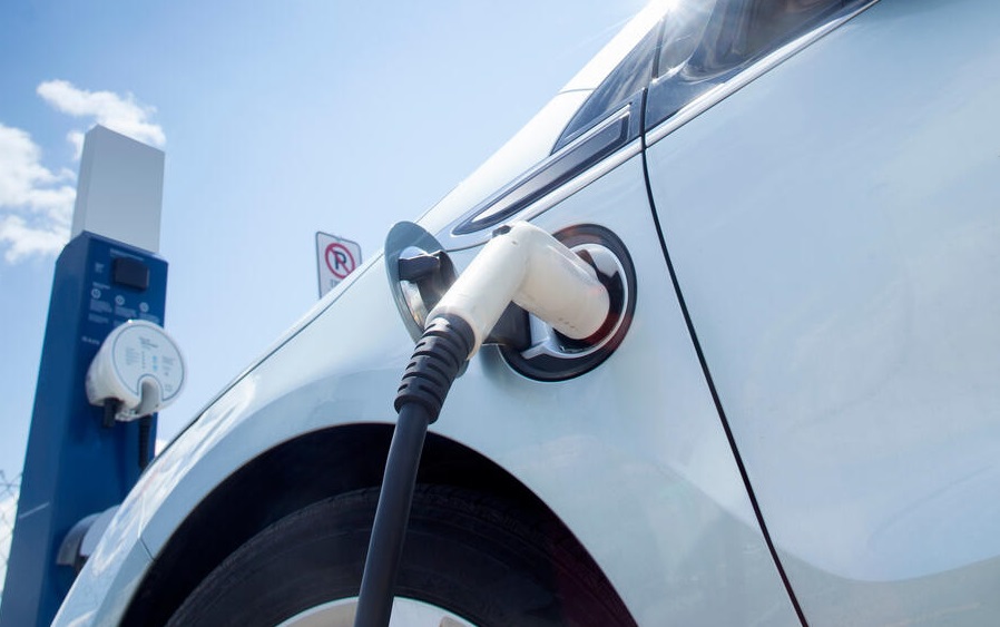 Electric car at charging station