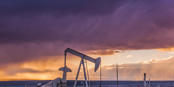 Oil drill at sunset