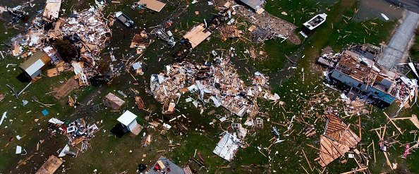 This aerial view shows damage to a neighborhood by Hurricane Laura outside of Lake Charles, Louisiana, on August 27, 2020.