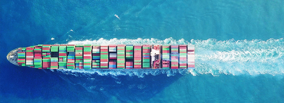 Ship at sea with shipping containers