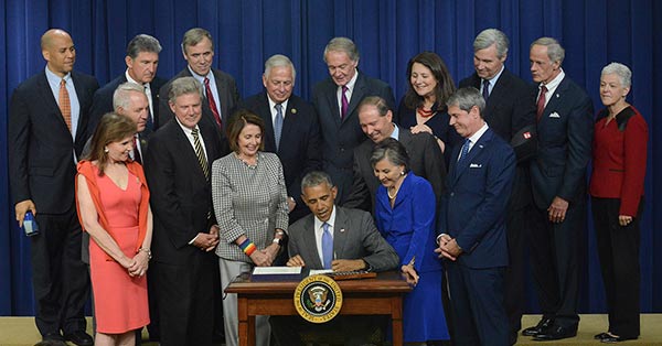 President Obama signing The Lautenberg Act