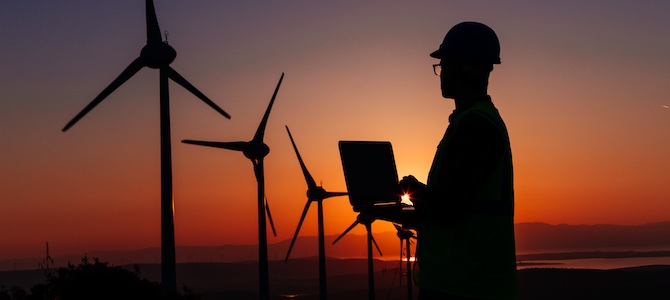Clean energy worker with wind turbines