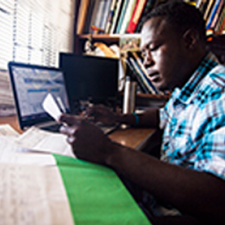 Black man working at a desk