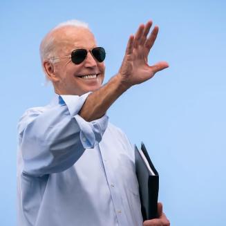 President Biden smiling in sunglasses