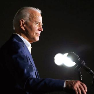 President Biden speaking at lectern