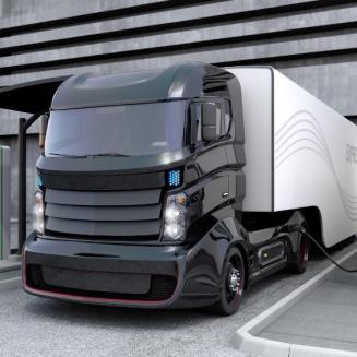 Hybrid electric truck being charging at charging station