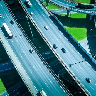 Cars and trucks traveling on looping highways