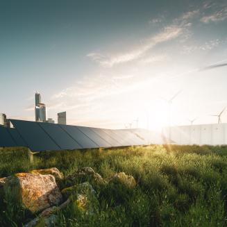 Wind turbines and solar panels in the distance.