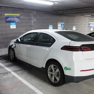 An electric car parked at a charging station