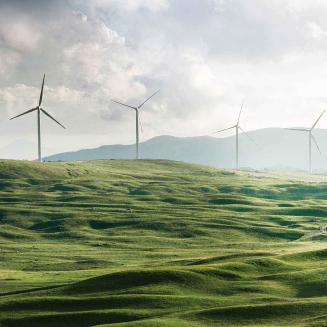 Wind turbines on a green hillside