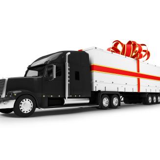 A semi-truck wrapped in a bow