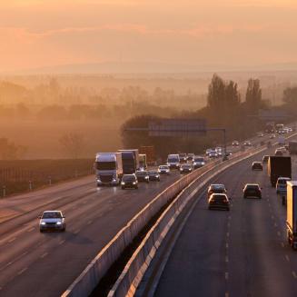 Cars and trucks driving on a highway