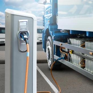 Electric truck being charged