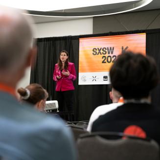 Ilissa Ocko on stage giving a talk at South by Southwest