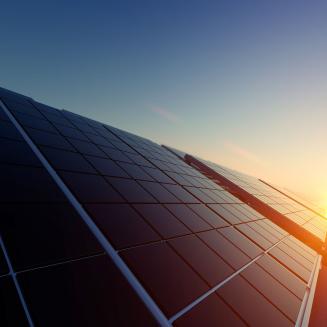 Solar panels basking in a gorgeous sunrise