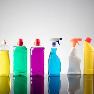 Various multicolored bottles of household cleaning products