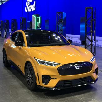A yellow electric Ford Mustang