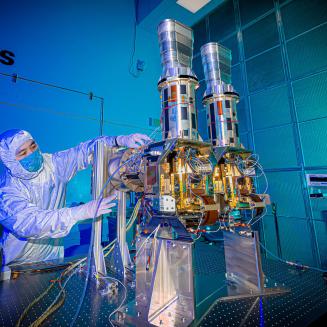 Person in lab preparing instrument for MethaneSAT methane-tracking satellite