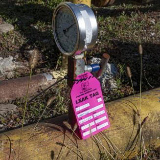 Gas gauge with a "leak tag" hanging from it