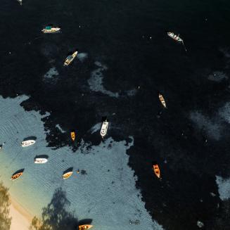 Aerial view of fishing boats near the beach in Grenada