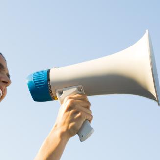 Woman shouting into megaphone