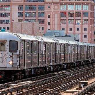 NYC subway heading down on rails