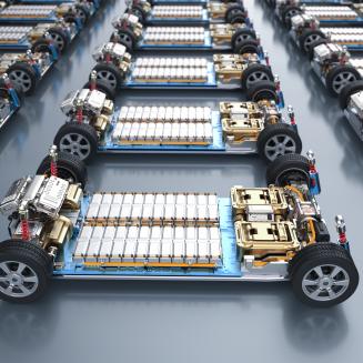 Group of electric cars with pack of battery cells module on platform