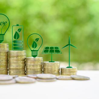 Stacks of coins with icons representing energy savings