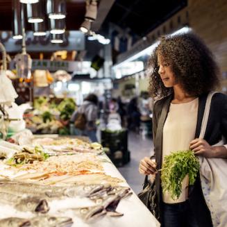 Woman shopping for seafood