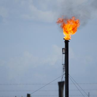 Gas is flared from an oil pad in Texas