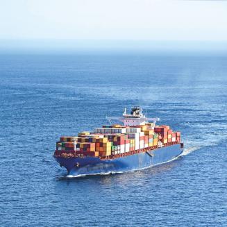 A shipping boat traveling through the ocean.