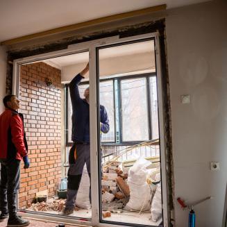 Man doing work on a doorway