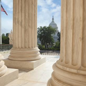U.S. Capitol building as seen through columns