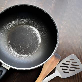 A nonstick pan with a scratched surface. Harmful forever chemicals, or PFAS, are still used in many nonstick pans